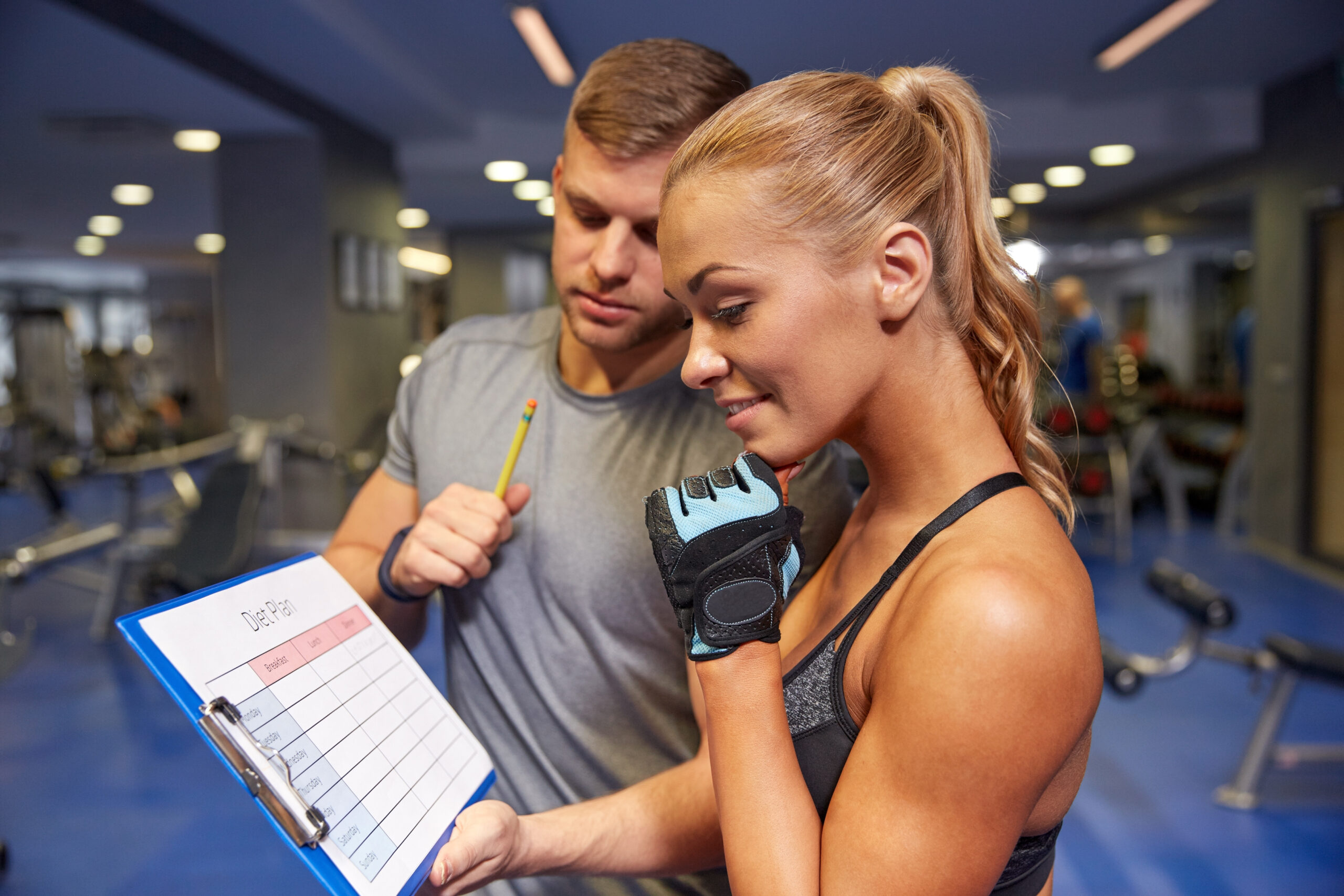 Fitness coach reviewing a training plan with a client